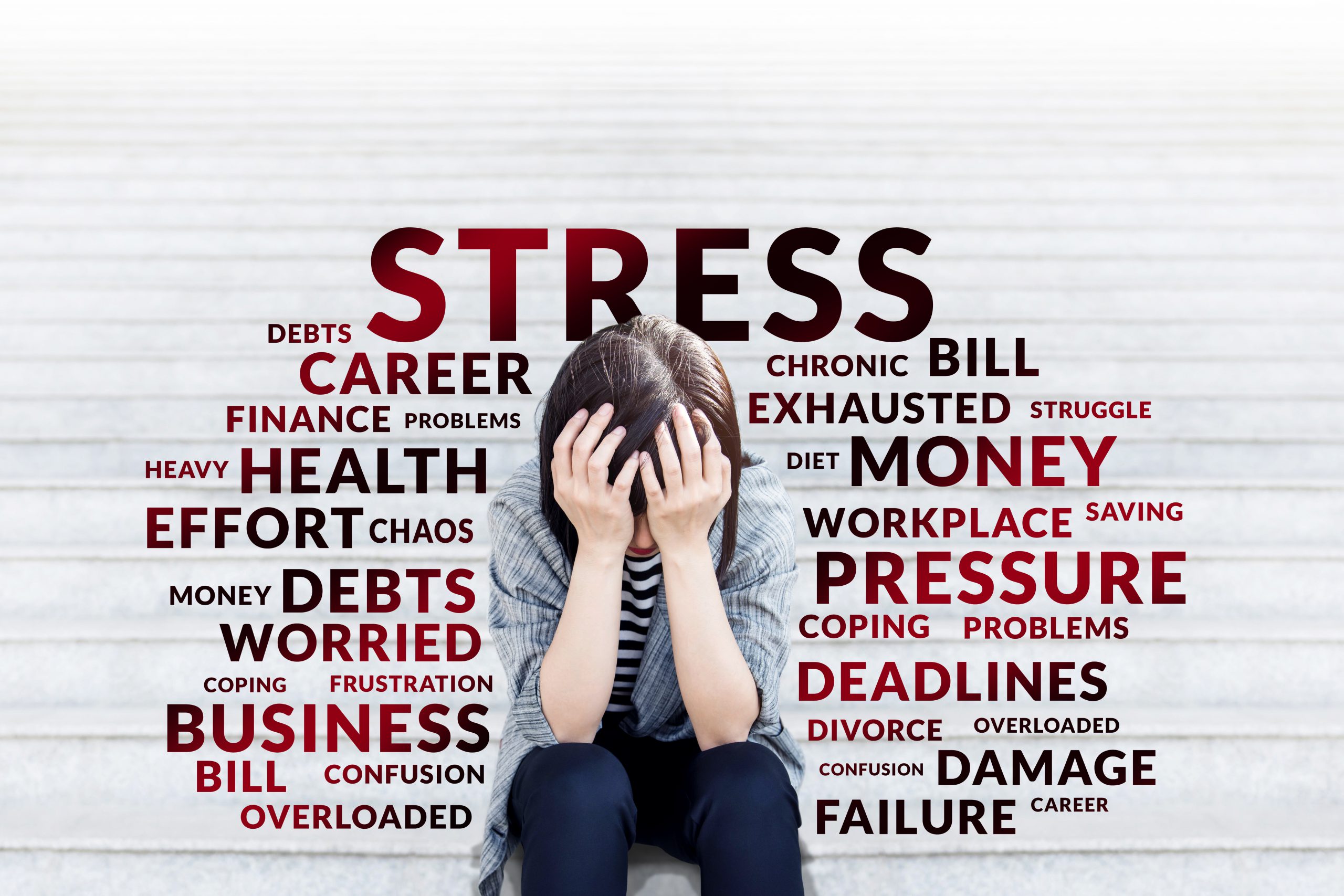 Depressed business woman sitting on stair Business woman in Stress moment sitting on stair outdoor, hands on head with bad headache, Surrounded with Negative and depress wording